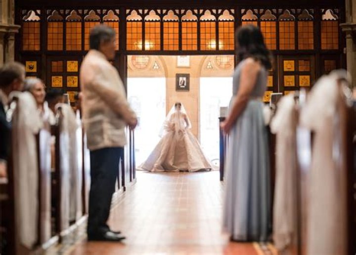 Do fathers have to walk daughter down the aisle?